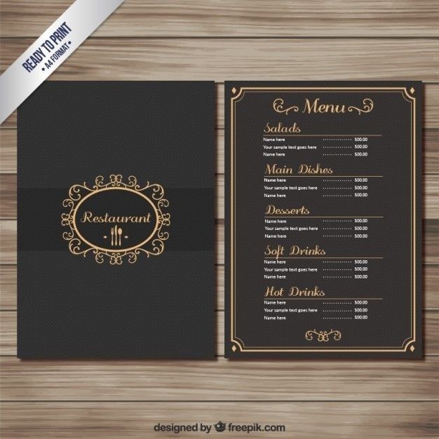 Menu de restaurant noir et doré ouvert sur une table en bois